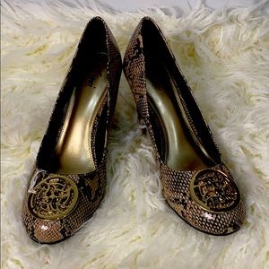 Fioni Woman’s Snakes Skin Print Medallion Wedges